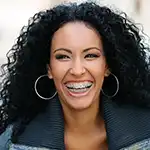 Woman with braces smiling