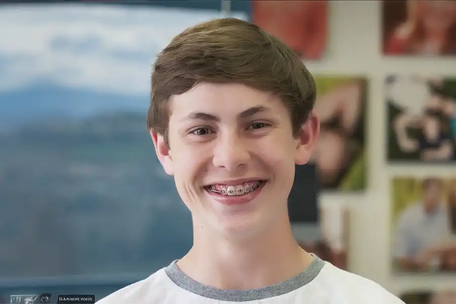 Boy with braces smiling