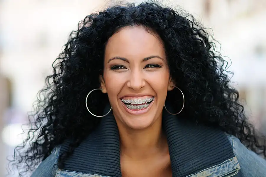 Woman smiling with braces.