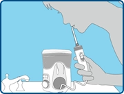 Step 3 diagram showing proper posture and body position over sink when using a water flosser.