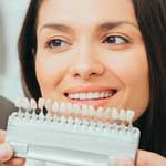 Dentist professional showing veneers, woman with beautiful teeth