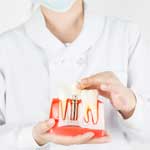 Dental professional showing implant