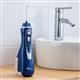 Blue Cordless Advanced Water Flosser WP-563 In Bathroom