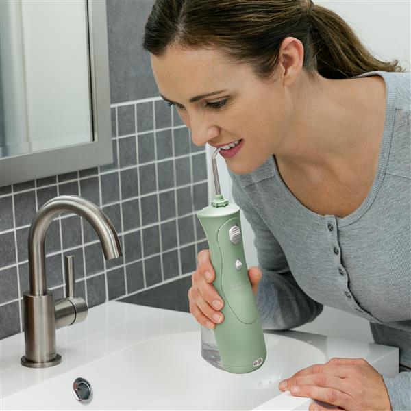 Using WP-468 Mint Green Cordless Plus Water Flosser