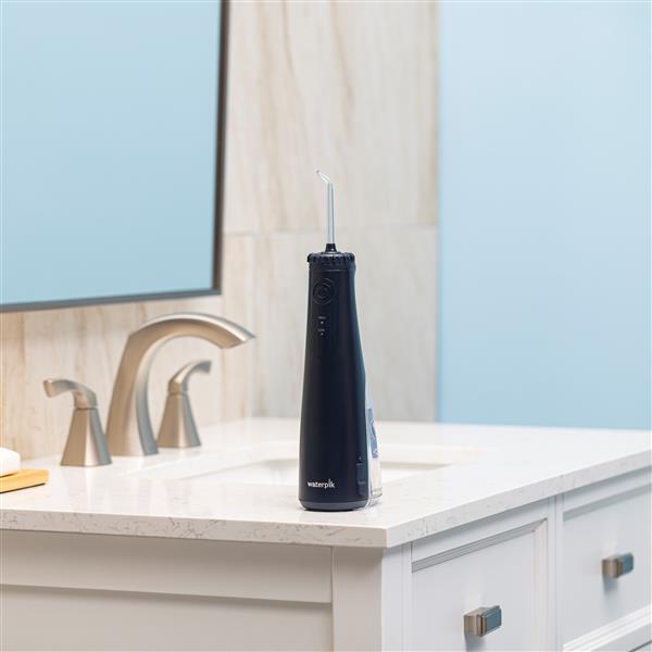 Blue Cordless Gem 5100 Water Flosser WF-27 in Bathroom