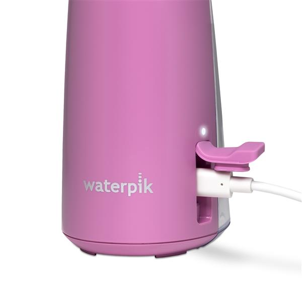 Charging port on the base of the mauve Cordless Pulse 3100 handheld water flosser.