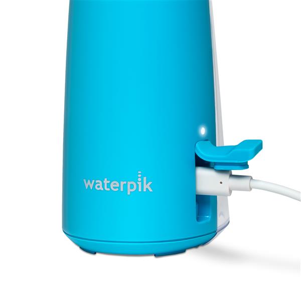 Charging port on the base of the cyan Cordless Pulse 3100 handheld water flosser.