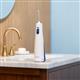 White Cordless 1200 handheld water flosser on a bathroom sink.