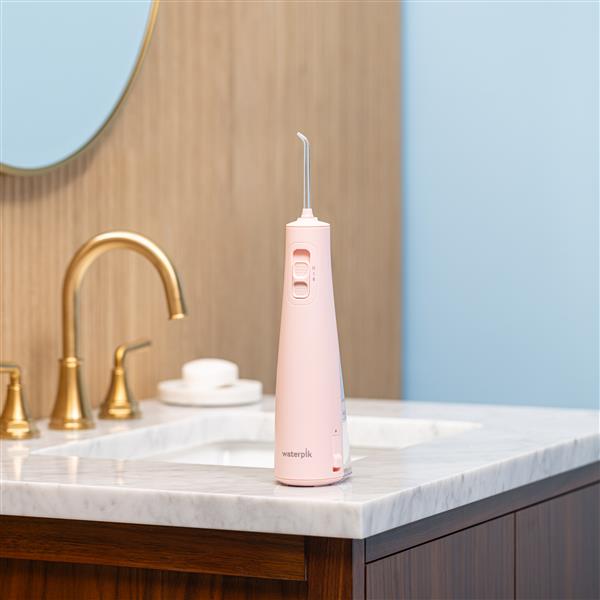 Pink Cordless Pulse 3100 Water Flosser WF-20CD014 in Bathroom