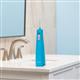 Cyan Cordless Pulse 3100 handheld water flosser on a bathroom sink.