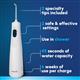White Cordless 1200 handheld water flosser features: 2 specialty tips, 2 safe and effective settings, use in the shower, 45 seconds of water capacity, and 6 weeks of use per charge.