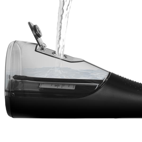 Filling the water reservoir of the Black Cordless Enhance 3200 handheld water flosser.