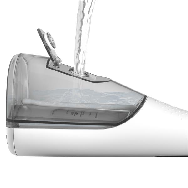 Filling the water reservoir of the White Cordless Enhance 3200 handheld water flosser.