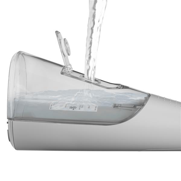 Filling the water reservoir of the Gray Cordless handheld water flosser.