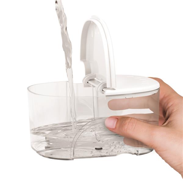 Filling the water reservoir of the white ION countertop water flosser.