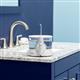 White ION countertop water flosser on a bathroom sink.