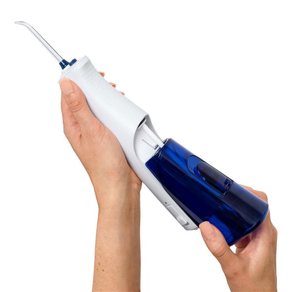Sliding the water reservoir to remove it from the White Cordless 1200 water flosser handle.