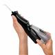 Sliding the water reservoir to remove it from the Black Cordless Enhance 3200 water flosser handle.