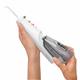 Sliding the water reservoir to remove it from the White Cordless Enhance 3200 water flosser handle.