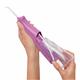 Sliding the water reservoir to remove it from the mauve Cordless Pulse 3100 water flosser handle.