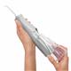 Sliding the water reservoir to remove it from the Gray Cordless water flosser handle.