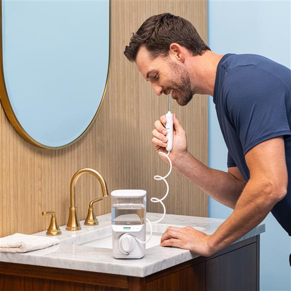 Using White PROMAX Water Flosser WF-23