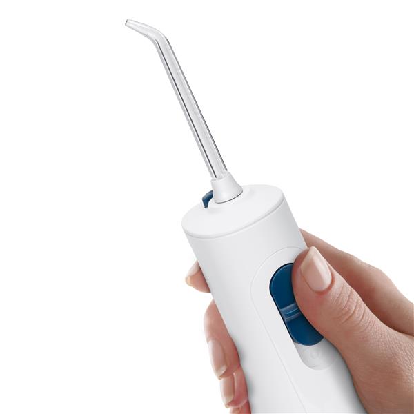 White Cordless 1200 handheld water flosser handle, shown held in a hand for scale.