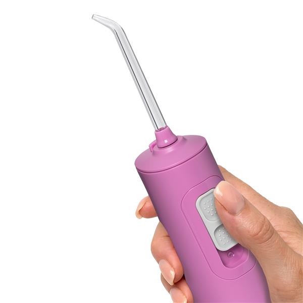 Mauve Cordless Pulse 3100 handheld water flosser handle and tip, shown held in a hand for scale.