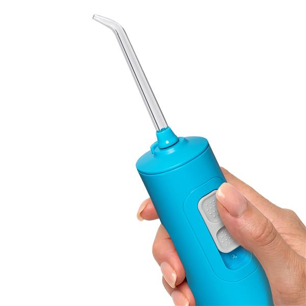 Cyan Cordless Pulse 3100 handheld water flosser handle and tip, shown held in a hand for scale.