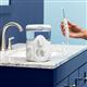 Hand holding handle of Ultra Plus water flosser on bathroom counter